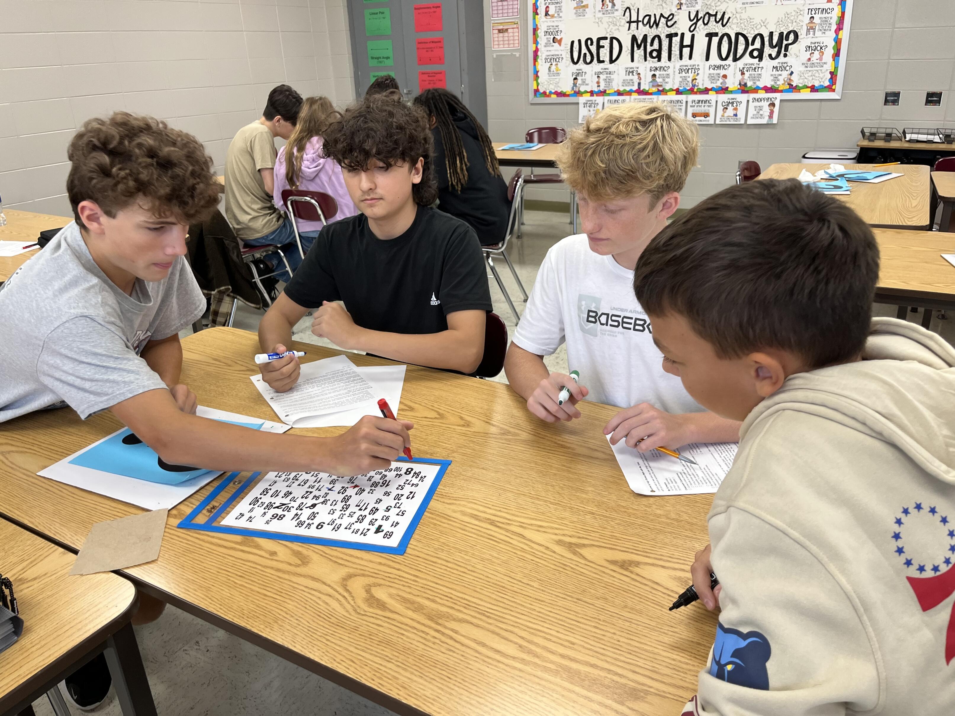 Students working on code puzzle