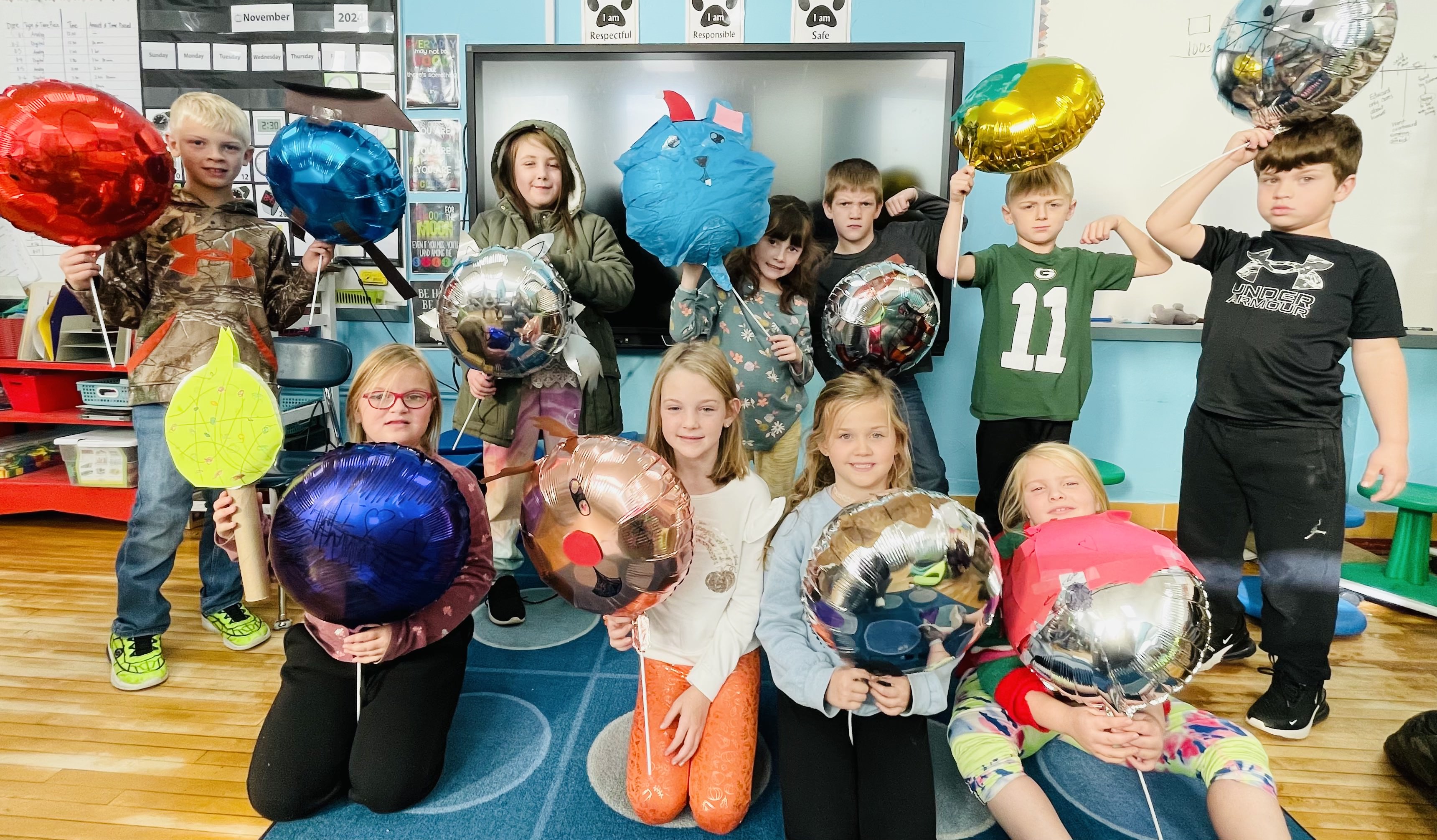 Students holding balloons
